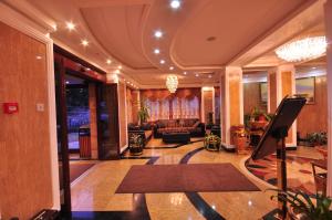 a lobby with a living room with a couch at Hotel Arca lui Noe in Sinaia