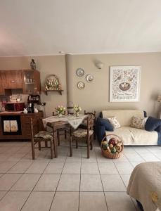 a living room with a couch and a table at Il Cortiletto in Assemini
