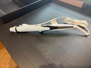 a hair dryer with a white cord on a table at Lento Stay HAGI in Hagi