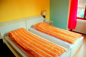 Postel nebo postele na pokoji v ubytování Hôtel de l'ours