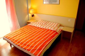 Postel nebo postele na pokoji v ubytování Hôtel de l'ours