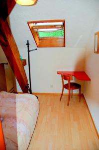 Postel nebo postele na pokoji v ubytování Hôtel de l'ours