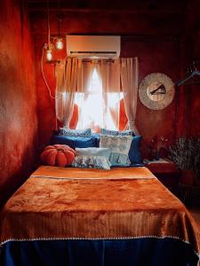 a bedroom with a bed with a window at Alter Space Workspace and CoLiving in General Luna