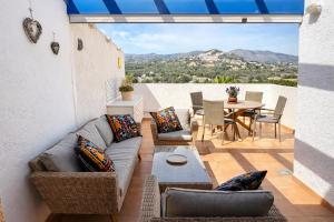 a living room with a couch and a table at Casanova 20G Calpe - Ifach Holiday Homes in Calpe