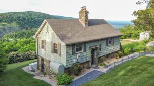 a small house on top of a hill at Gatekeeper Cottage Views, Fireplace, EV in Afton