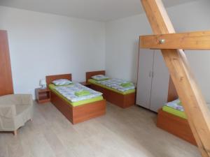 Postel nebo postele na pokoji v ubytování Agropenzion U Bartousku
