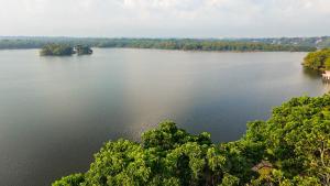 an aerial view of a lake with trees at Pearl Bolgoda in Piliyandala