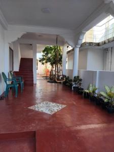 a room with a staircase and a floor with plants at Blue Moon Rest Inn in Trincomalee