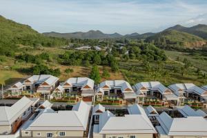 an aerial view of a village with houses and mountains at laboon pool villa Pranburi in Ban Nong Ban Kao