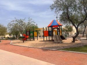 a park with a playground with slides and a play structure at Private Apartment in Prague Poniente Area in Hermosillo