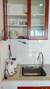 a kitchen counter with a sink and a toaster at Lipa Bay Residence in Nathon Bay +160 photos