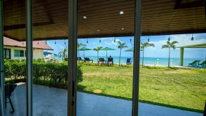 a view of the beach from inside a house at Lipa Bay Residence in Nathon Bay