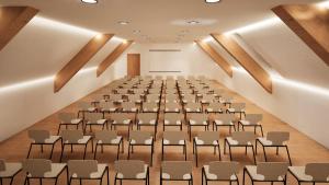 an empty lecture hall with rows of chairs in it at Butični Hotel Sončno Polje in Moravske-Toplice +33 photos