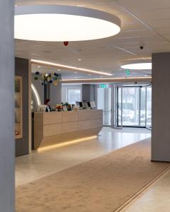 an office with a reception desk in a building at Hotel Senec Aqua Resort - Family friendly in Senec +65 photos