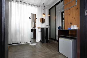 a bathroom with a shower in the corner of a room at serene hotel in Chiang Mai