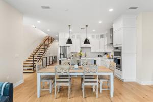 a kitchen and dining room with a table and chairs at 40 8th Avenue in Indialantic