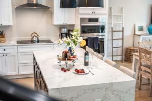 a kitchen with a table with a plate of fruit on it at 40 8th Avenue in Indialantic