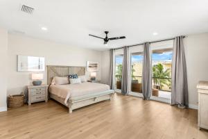 a bedroom with a bed and a large window at 40 8th Avenue in Indialantic +52 photos