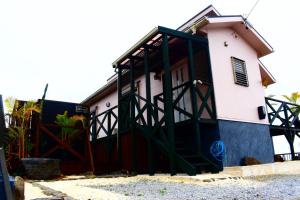 a house with a large gate in front of it at 118 Terrace in Nakijin