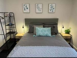 a bedroom with a large bed with two night stands at Swansea Cabins in Swansea