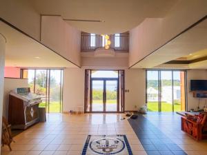 a large living room with a large open door at Garden BBQ and Stay ANCHOR in Miyakojima
