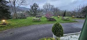 a park with benches and lights on the grass at LURRA Tierra Apartamento 1 in Sopuerta