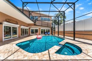 a swimming pool with a pink duck in a house at 464 Indian Creek Dr in Cocoa Beach