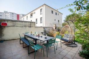 a table and chairs sitting on a patio at Casa Dina - in Chalon-sur-Saône