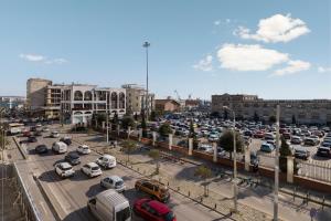 a parking lot full of cars in a city at PortoVista Luxury Urban Suites by BiNoBi! in Thessaloniki