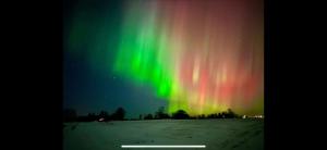 an image of the northern lights in the sky at Kurimon Majatalo in Kianta