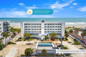 a view of a hotel with the beach in the background at Boardwalk 205 in Cocoa Beach