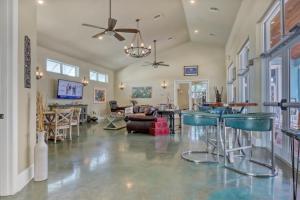 a large living room with blue bar stools at Cape Crossing 103 in Merritt Island