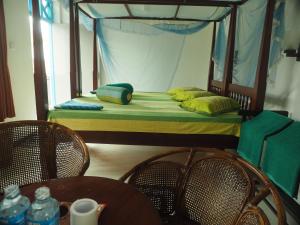 Letto o letti in una camera di Main Reef Guest House