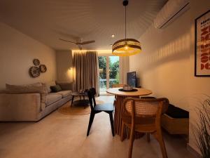 a living room with a table and a couch at Central Luxury Sea View Apartment in Chalkida
