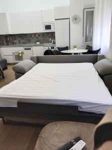 a large bed in a living room with at RockSide Residences Suites La Línea VII in La Línea de la Concepción