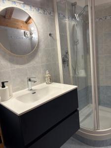 a bathroom with a sink and a shower at Casa Polly in Rovereto