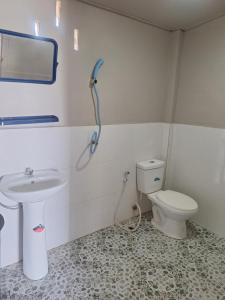 a bathroom with a sink and a toilet at Champa resort in Don Det