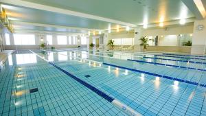 a large swimming pool in a large building at Chill Place 120 Ayase in Tokyo