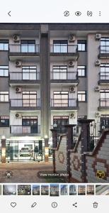 a tall building with balconies and stairs in front of it at Luxury lita Résidence in Yaoundé