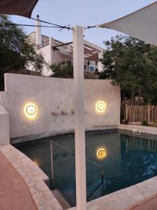a swimming pool with lights on the side of a house at Casa Mimi B&B Adults Only in Gérgal +52 photos