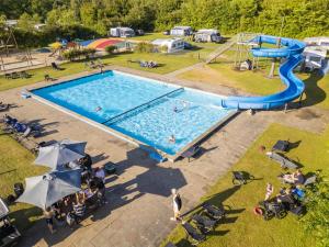 an overhead view of a pool with a water slide at DCU-Camping Hesselhus in Silkeborg