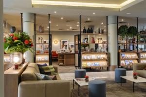 a store with couches and tables in a room at Adina Apartment Hotel Budapest in Budapest