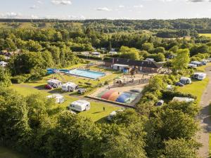 an aerial view of a parking lot with a pool at DCU-Camping Hesselhus in Silkeborg