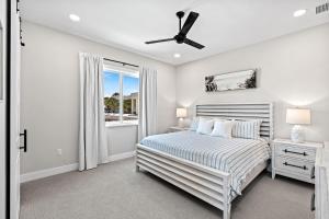 a bedroom with a bed and a window at 50 8th Avenue in Indialantic +55 photos
