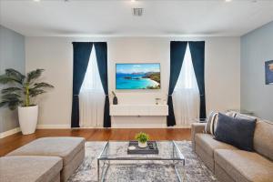 a living room with a couch and a table at 51 N Orlando Ave in Cocoa Beach