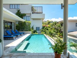 an image of a swimming pool in a house at Luxe 4BR Sunset Seaview Villa Private Infinity in Plai Laem