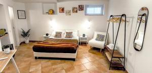 a bedroom with a bed and a chair in it at Regina Margherita in Crotone