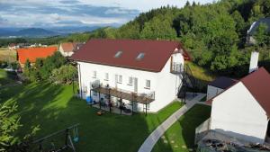 an aerial view of a white house with a red roof at Apartamenty Siedlisko in Ostre
