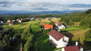an aerial view of a small village with a white house at Apartamenty Siedlisko in Ostre