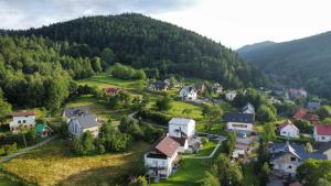 an aerial view of a small village in the mountains at Apartamenty Siedlisko in Ostre